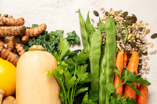 Different fresh vegetables as background.