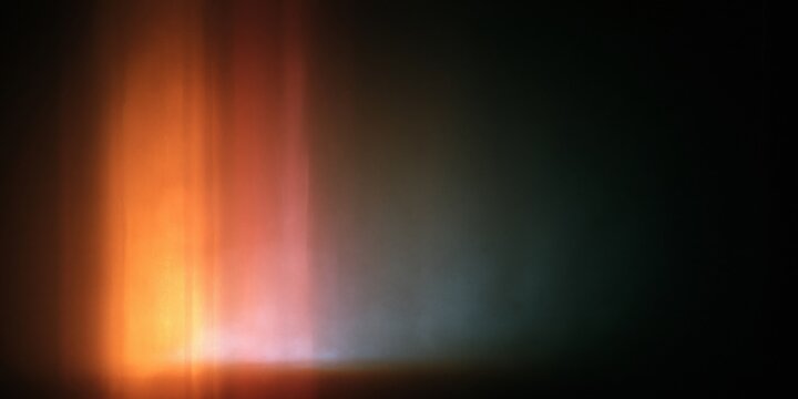 Abstract vertical light beams on dark background