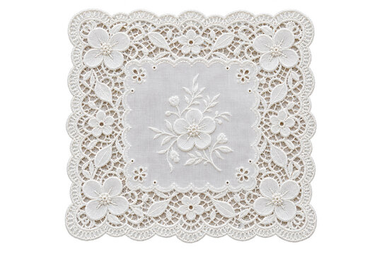 Decorative white lace doily with floral embroidery isolated on a white background