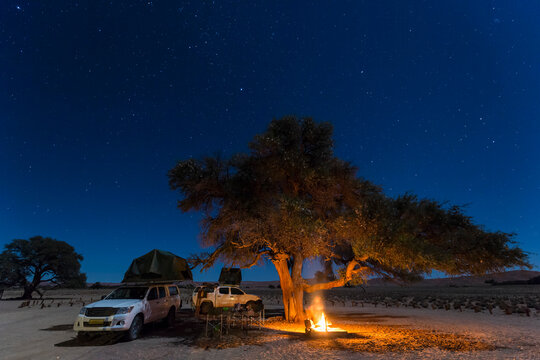 Namibia, Namib Desert, Namib Naukluft National Park, camping with camp fire by night