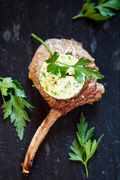 Slice of compound butter on lamb chop