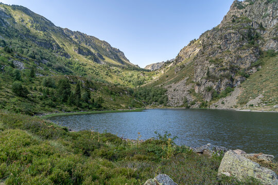 Etang de Comte Mountain Lake in Pyrenees Mountains Ariege France, Scenic Glacial Water, Steep Rocky Slopes, High Altitude Valley View