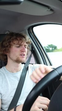 Vertical screen driver checks his wristwatch while stuck in heavy city traffic feeling anxious and impatient because congestion is making him late for a business meeting