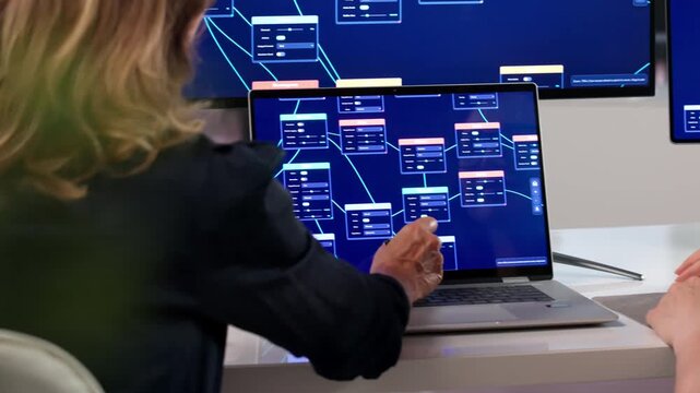 Young Woman Builds Automation Workflow On Laptop