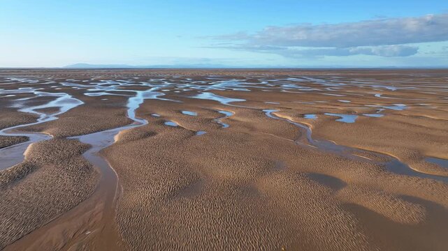 Low Flight Over Tidal Sands At Golden Hour. Fleetwood, Lancashire, England, UK.