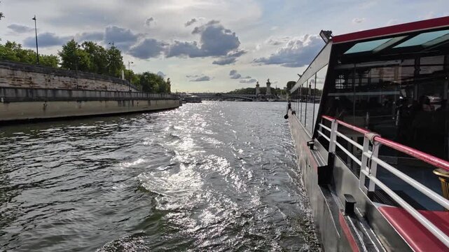 Scenic View From A Bateaux Mouches Tour Boat Navigating Down The Seine River In Paris France
