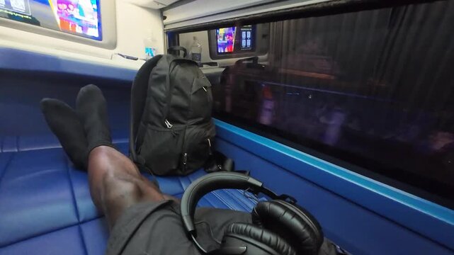 Traveling overnight on a sleeper bus with the window open, capturing passing nighttime scenery and the atmosphere of long-distance travel in Southeast Asia.