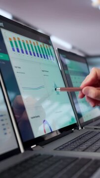 Mature Woman Studies Supplier Data On Laptop