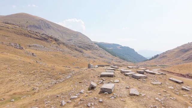 Aerial Flyover of Ancient Stecci Tombstones Necropolis on Dry Visocica Mountain Slopes
