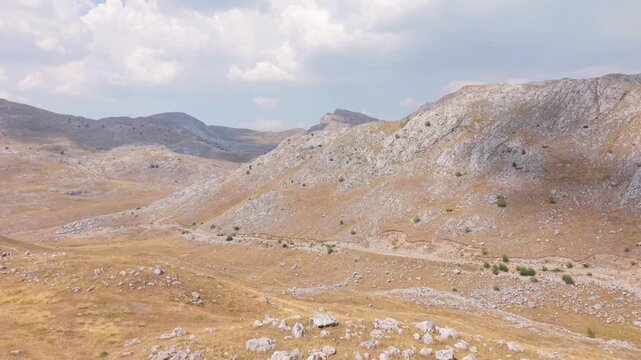 Aerial Flyover of Arid Rocky Peaks and Dry Slopes on Visocica Mountain