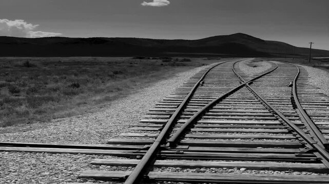 Film noir old  movie style clip of the railroad tracks at the Golden Spike Park National Historic Park, Utah . The two railroads met here on completion of the transcontinental railroad in 1869