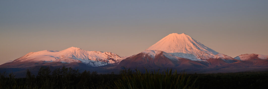 Mt Tongariro (left) and volcanic cone of Mt Ngauruhoe (right) at sunset. Tongariro National Park. New Zealand.