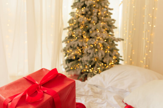 Winter scene with a Christmas tree gifts and soft blankets in a cozy interior space