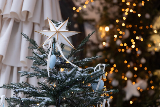 Decorative Christmas tree in a cozy indoor space with lights and ornaments