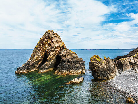 Blackchurch Rock and Cliffs over Mouthmill Beach from a drone, North Devon Coast, Devon, England