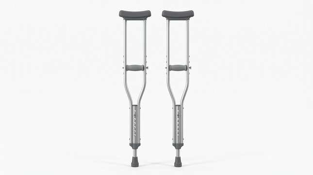 Pair of adjustable aluminum axillary crutches. Silver frame with gray padded underarm rests, hand grips, and non-slip rubber tips. Height adjustable with push pins.