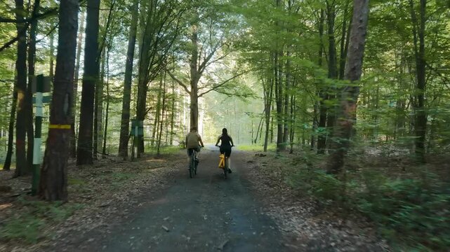 Young couple enjoying an adventurous ride through the woods