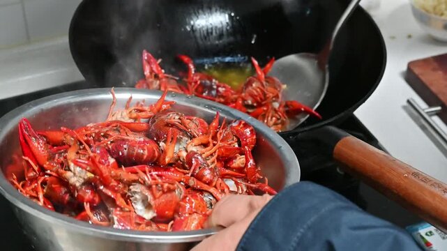 Cooking Spicy Crayfish in Wok at Chinese Kitchen