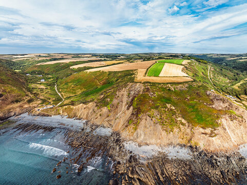 Cliffs and Fields over Welcombe Mouth Beach from a drone, North Devon and Cornwall Coastpath Border, Devon, England, Summer 2026