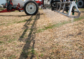 demonstrates the operation of a boom field sprayer, which evenly applies liquid fertilizer solutions or plant protection © pavlobaliukh