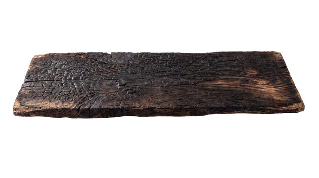 Angled photograph of a darkly charred wooden plank, showcasing its rough, burnt texture and rustic.