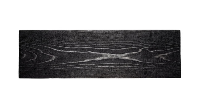 Overhead photograph of a darkly charred wooden plank, featuring striking.