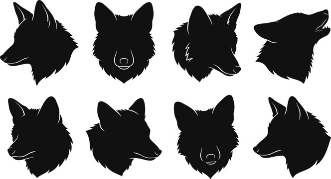 Set of black silhouette fox heads in various poses isolated on white background