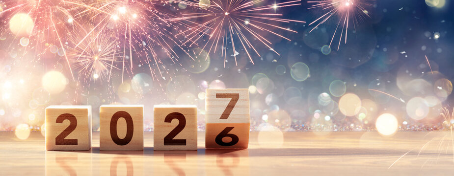 2027 New Year Celebration - Wooden Number Blocks And Fireworks At Blue Eve Night With Abstract Defocused Lights