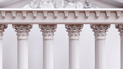 Fototapeta premium Corinthian columns support an ornate entablature and sculpted classical pediment, ancient Greek architecture