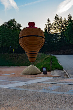 Giant Spinning Top Sculpture in Public Outdoor Area, St Hilary of Sacalm, Catalonia, Spain.