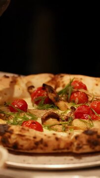 Chef Drizzling Oil on Artisan Pizza