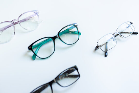 Glasses for vision on a white background in optical store. Vision test concept, stylish glasses concept