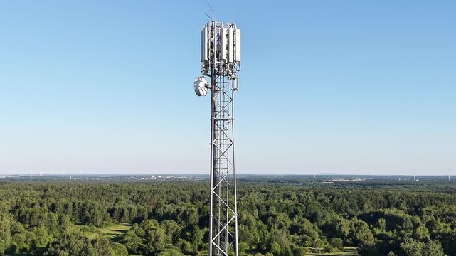 Cellular antenna tower for wireless internet access over forest background