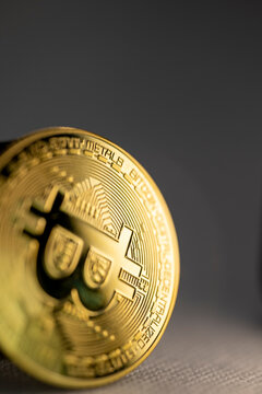 Shiny bitcoin coin on dark grey background The Concept of financial investment