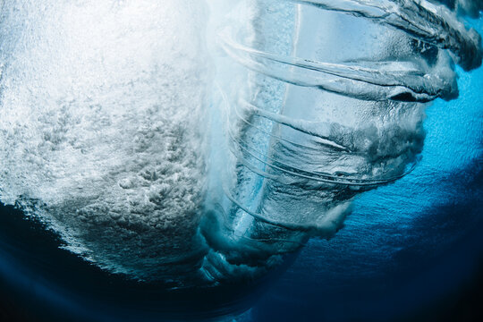 Close-up Underwater view of a wave breaking over shallow sand in the Pacific Ocean, Hawaii, USA