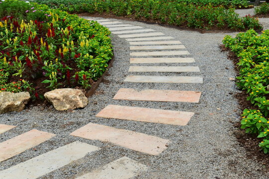 beautiful landscape garden pathway with rock decorative flower and green plant