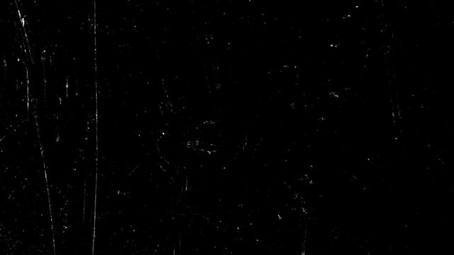 4K old film damage background loop. White scratches and dust on black texture for retro cinematic overlay.