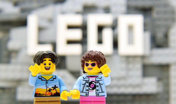 Lego minifigures are staying on mountain with word LEGO are builded from white bricks. Editorial illustrative image of popular brand of plastic bricks constructor.