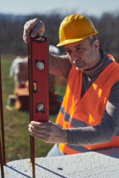 Construction worker working outdoors on a construction site.