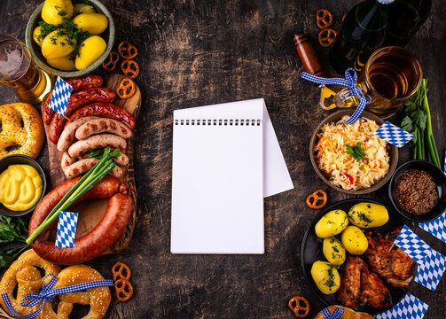 Oktoberfest food: beer brezel sausages cabbage potato and chicken