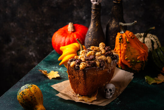 Halloween pumpkin cake decorated with skull