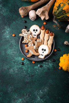 Halloween scary gingerbread cookies in shape of skull zombie and mummy