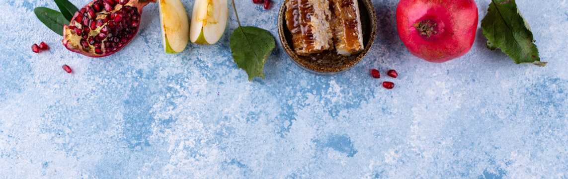 Rosh Hashana Jewish New Year concept with honey apple and pomegranate