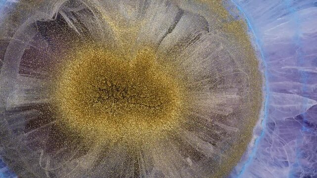 Mixing alcohol inks and epoxy resin to create colorful designs