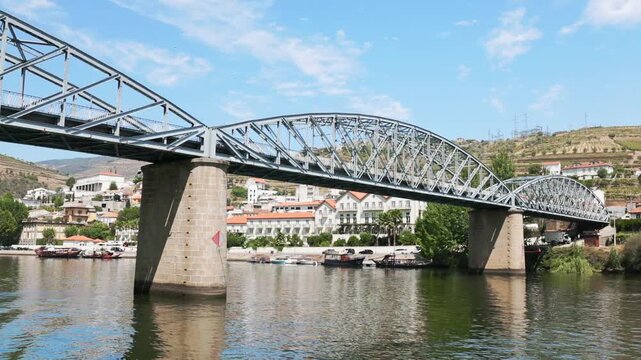Views of the bridge over the Douro River in Vale do Rio Douro during a sunny day