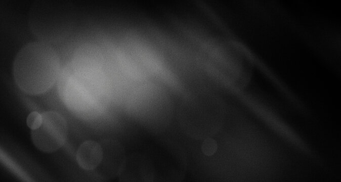 Abstract Black and White Light Leak Background with Soft Lens Flare, Cinematic Film Grain Noise and Retro Glowing Overlay Effect