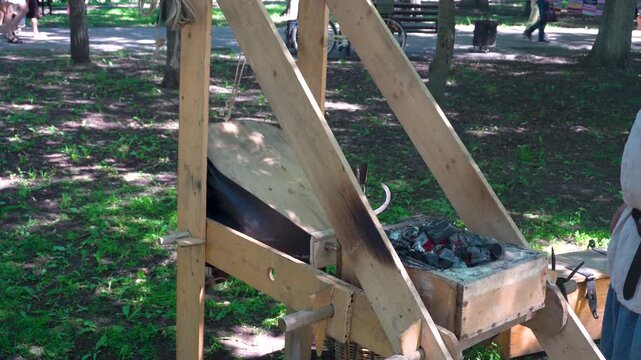 Blacksmith's bellows for heating a metal workpiece. An ancient device for forging metal.