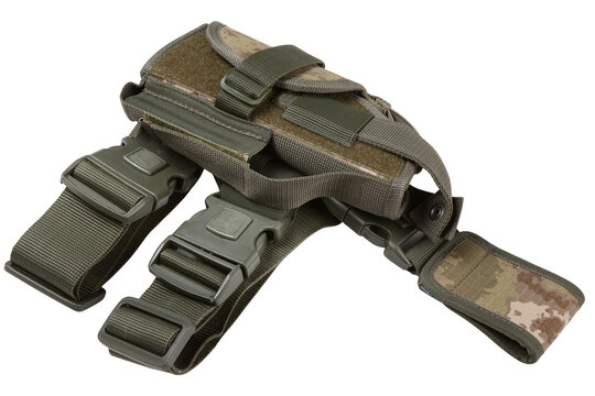 Tactical drop leg holster angle shot isolated on white background. Military camouflage pistol thigh rig