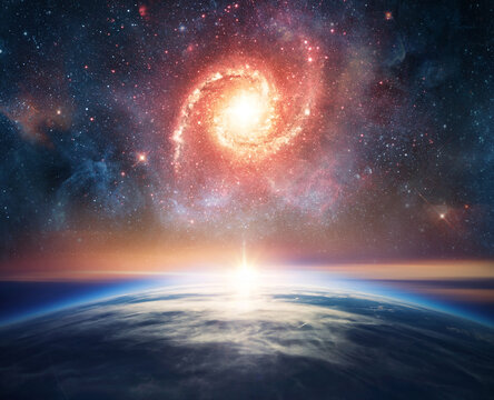  Earth from space with bright stars, colorful nebula and deep cosmic sky above the planet horizon.Elements of this image furnished by NASA.