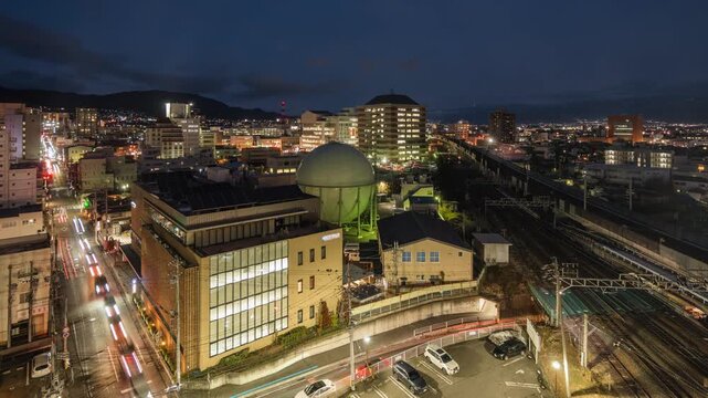 Dusk to night time lapse of Nagano City, the capital and largest city of Nagano Prefecture, Japan, zooming out. 